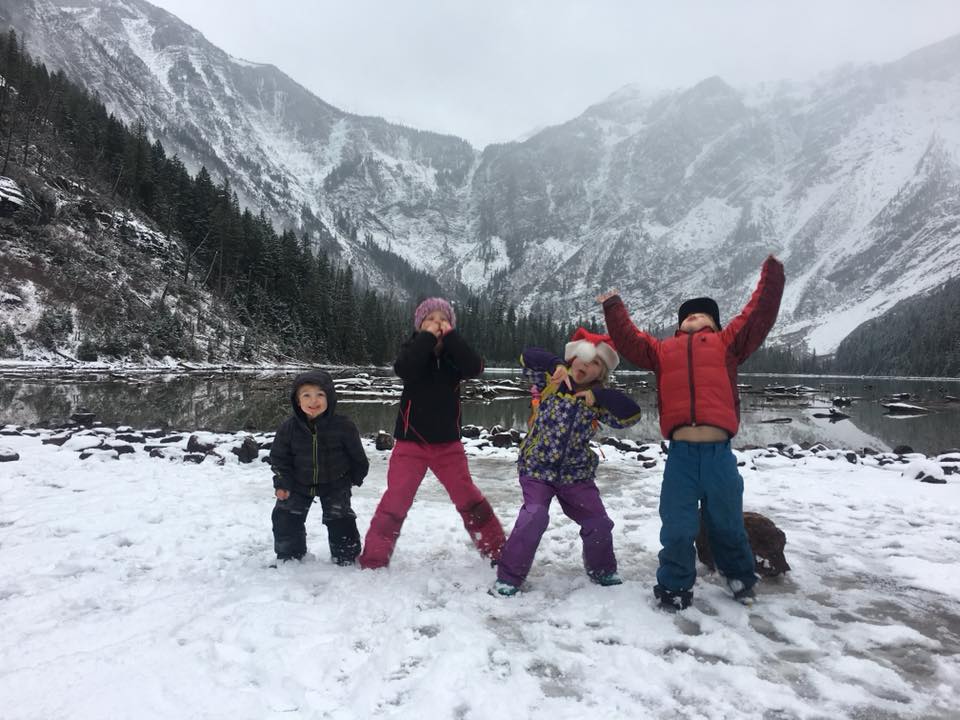 kids celebrating their arrival to Avalanche Lake in December